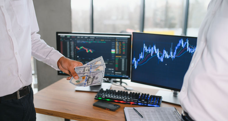 Computers showing charts of the stock market.